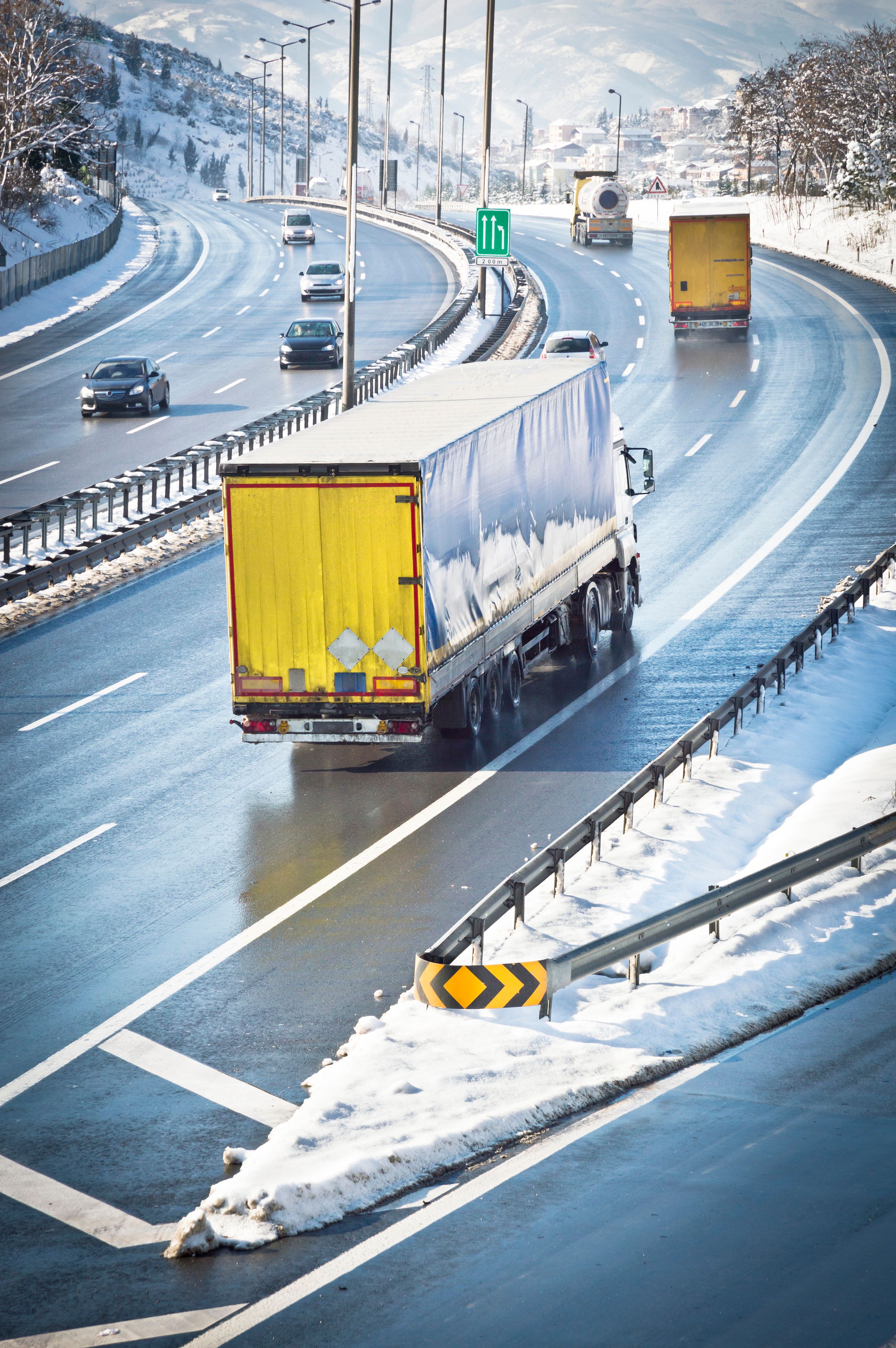 Vehicle being loaded onto transport truck